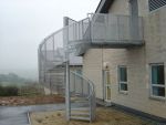 SPIRAL FIRE SESCAPE WITH PERFORATED BALUSTRADE